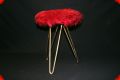 Vintage metal stool with red fur seating surface